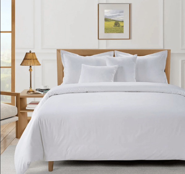 white bed sheet hotel